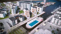 Dronefoto af de nybyggede hvide bygninger og havnebadet i Stenfiskerkajen i Odense
